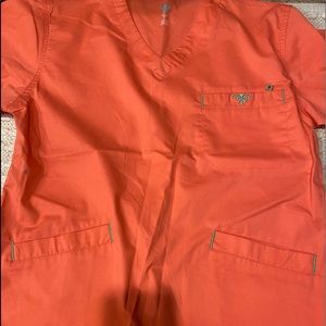 Med couture peach colors top